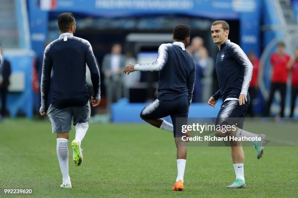 Antoine Griezmann of France speaks to a team member during a training session at Nizhny Novgorod Stadium on July 5, 2018 in Nizhny Novgorod, Russia.