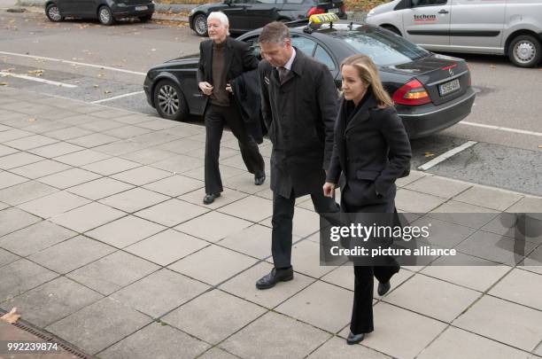 The former drugstore owner Anton Schlecker and his daughter Meike Schlecker arrive at the regional court in Stuttgart, Germany, 27 November 2017....