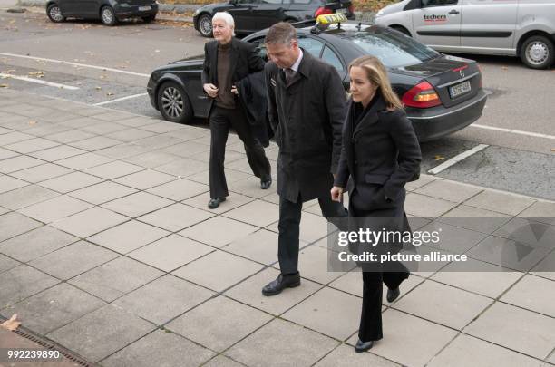 The former drugstore owner Anton Schlecker and his daughter Meike Schlecker arrive at the regional court in Stuttgart, Germany, 27 November 2017....