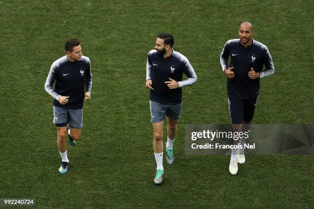 Florian Thauvin, Adil Rami and Steven Nzonzi of France warm up during a training session at Nizhny Novgorod Stadium on July 5, 2018 in Nizhny...