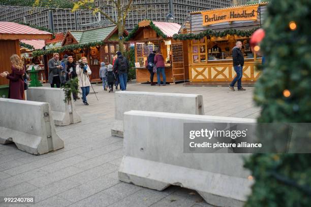 Concrete barriers stand at the entrance to the christmas market at the Kaiser Wilhelm Memorial Church on the Breitscheidplatz square in...