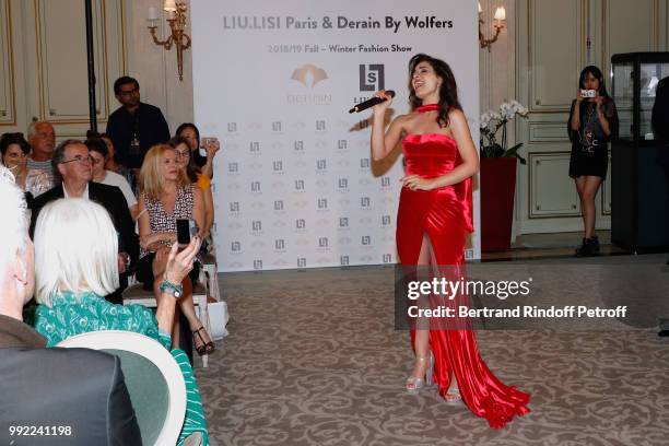 Singer performs during the Liu Lisi - Paris Fashion Week - Haute Couture Fall Winter 2018/2019 at Hotel Meurice on July 5, 2018 in Paris, France.