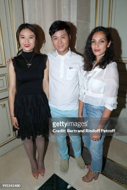 Stylist Liu Lisi poses with Serena Zhang and Hania Amar after the Liu Lisi - Paris Fashion Week - Haute Couture Fall Winter 2018/2019 at Hotel...