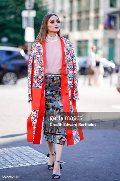 Olivia Palermo wears a flower print kimono jacket, a pink top, a skirt , outside Fendi, during Paris Fashion Week Haute Couture Fall Winter...