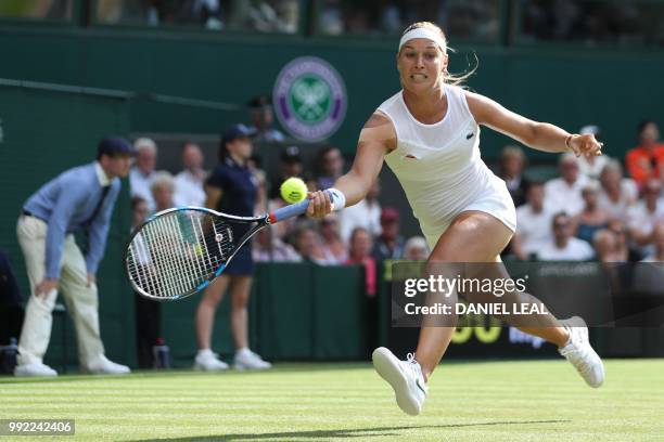 Slovakia's Dominika Cibulkova returns to Britain's Johanna Konta in their women's singles second round match on the fourth day of the 2018 Wimbledon...