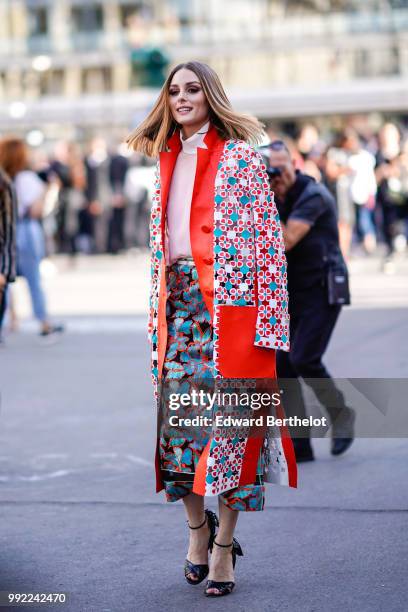 Olivia Palermo wears a flower print kimono jacket, a pink top, a skirt , outside Fendi, during Paris Fashion Week Haute Couture Fall Winter...