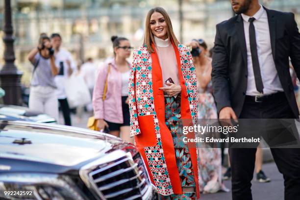 Olivia Palermo wears a flower print kimono jacket, a pink top, a skirt , outside Fendi, during Paris Fashion Week Haute Couture Fall Winter...