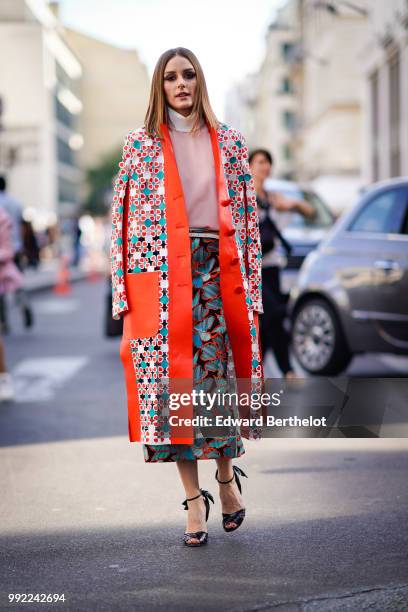 Olivia Palermo wears a flower print kimono jacket, a pink top, a skirt , outside Fendi, during Paris Fashion Week Haute Couture Fall Winter...