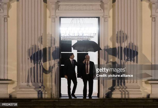 Volker Kauder, parliamentary group leader of the ruling CDU/CSU faction in the German Bundestag , leaves after a meeting with German President...