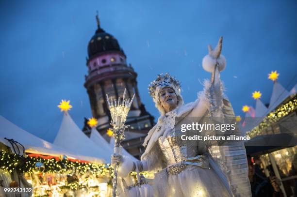 The snow queen greets visitors at the Gendarmenmarkt Christmas market in Berlin, Germany, 27 November 2017. The Christmas market in front of the the...