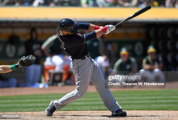 Yan Gomes of the Cleveland Indians bats against the Oakland Athletics in the eighth inning at Oakland Alameda Coliseum on June 30, 2018 in Oakland,...