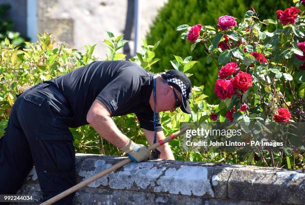 Police searching streets and houses in Ardbeg Road on the Isle of Bute in Scotland, after the body of Alesha MacPhail was found in woodland on the...