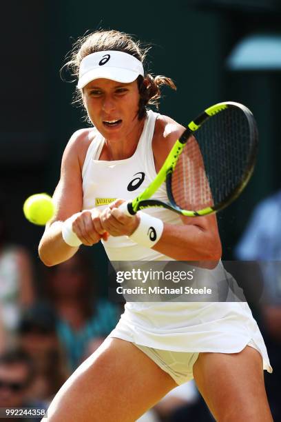 Johanna Konta of Great Britain returns a shot against Dominika Cibulkova of Slovakia during their Ladies' Singles second round match on day four of...