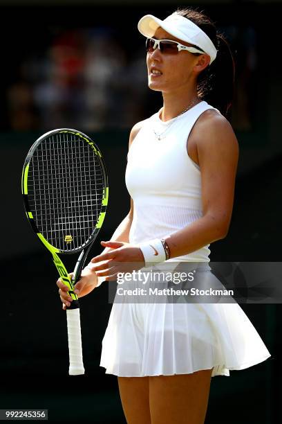 Saisai Zheng of China reacts against Simona Halep of Romania in their Ladies' Singles second round match on day four of the Wimbledon Lawn Tennis...