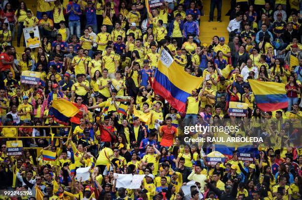 People wait at the Nemesio Camacho "El Campin" stadium in Bogota, where the Colombian national football team will be welcomed after their...