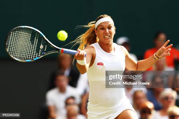 Dominika Cibulkova of Slovakia returns a shot against Johanna Konta of Great Britain during their Ladies' Singles second round match on day four of...