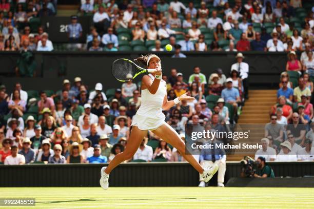 Johanna Konta of Great Britain returns a shot against Dominika Cibulkova of Slovakia during their Ladies' Singles second round match on day four of...