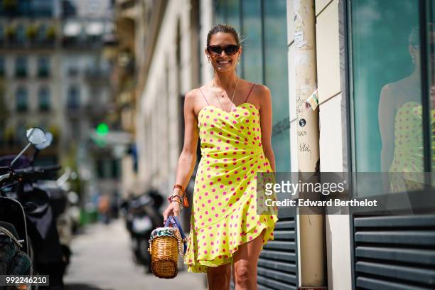 Helena Bordon wears a yellow off-shoulder dress with polka dots, outside Jean-Paul Gaultier, during Paris Fashion Week Haute Couture Fall Winter...