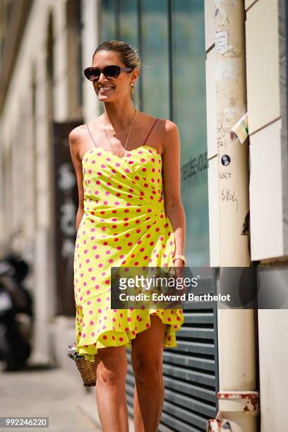 Helena Bordon wears a yellow off-shoulder dress with polka dots, outside Jean-Paul Gaultier, during Paris Fashion Week Haute Couture Fall Winter...