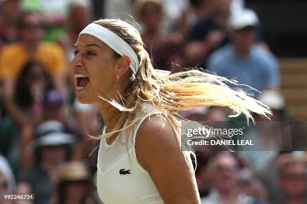 Slovakia's Dominika Cibulkova celebrates after beating Britain's Johanna Konta 6-3, 6-4 in their women's singles second round match on the fourth day...