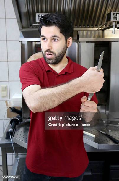 Kebab diner owner Ahmet Demir showing his reaction to the knifing attack on mayor Hollstein in his diner, "City Doner", in Altena, Germany, 28...