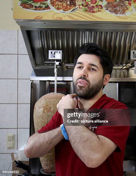 Kebab diner owner Ahmet Demir showing his reaction to the knifing attack on mayor Hollstein in his diner, "City Doner", in Altena, Germany, 28...