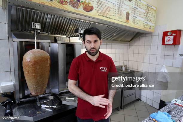 Kebab diner owner Ahmet Demir standing behind the counter in the "City Doner" diner in Altena, Germany, 28 November 2017. The mayor of the city of...