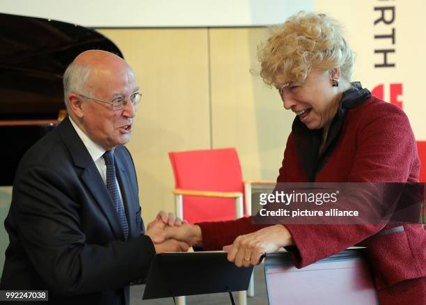 Political scientist Gesine Schwan awarding historian Etienne Francois his prize certificate during the awards ceremony of the Prix de l'Académie de...