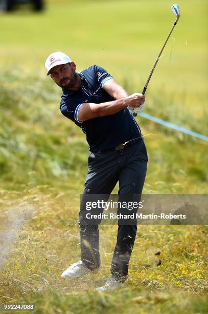 David Howell of England plays his second shot on the 1st hole during day one of the Dubai Duty Free Irish Open at Ballyliffin Golf Club on July 5,...