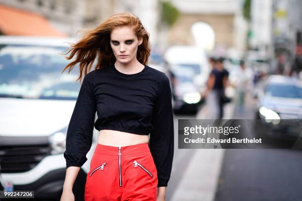 Model Alexina Graham wears a black top, outside Jean-Paul Gaultier, during Paris Fashion Week Haute Couture Fall Winter 2018/2019, on July 4, 2018 in...