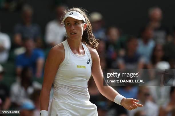 Britain's Johanna Konta reacts while playing Slovakia's Dominika Cibulkova in their women's singles second round match on the fourth day of the 2018...