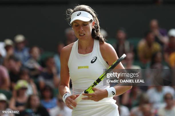 Britain's Johanna Konta reacts after losing to Slovakia's Dominika Cibulkova in their women's singles second round match on the fourth day of the...