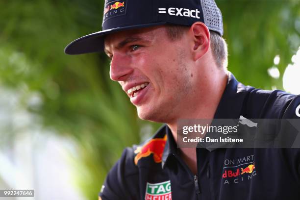 Max Verstappen of Netherlands and Red Bull Racing talks to the media in the Paddock during previews ahead of the Formula One Grand Prix of Great...