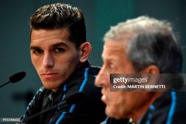 Uruguay's midfielder Lucas Torreira and Uruguay's coach Oscar Washington Tabarez attend a presse conference on July 5, 2018 at the Nizhny Novgorod...