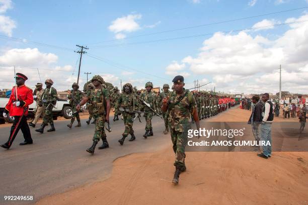 Malawi Defence Force soldiers hold a memorial parade on July 5 marching through Mtandile on their way to Bingu National Stadium, ahead of Malawi's...