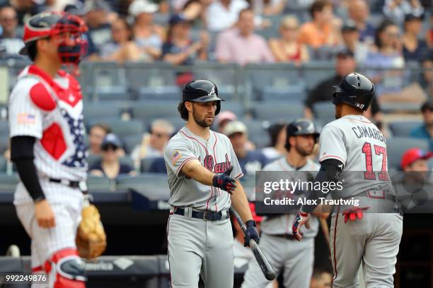 Johan Camargo of the Atlanta Braves celebrates with Charlie Culberson after hitting a solo home run during a game against the New York Yankees at...
