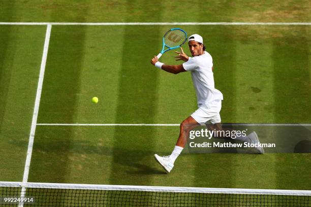 Feliciano Lopez of Spain returns a shot against Juan Martin del Potro of Argentina during their Men's Singles second round match on day four of the...