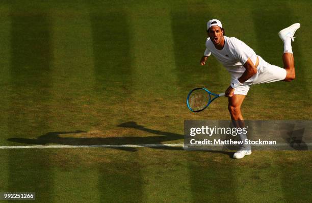 Feliciano Lopez of Spain serves against Juan Martin del Potro of Argentina during their Men's Singles second round match on day four of the Wimbledon...