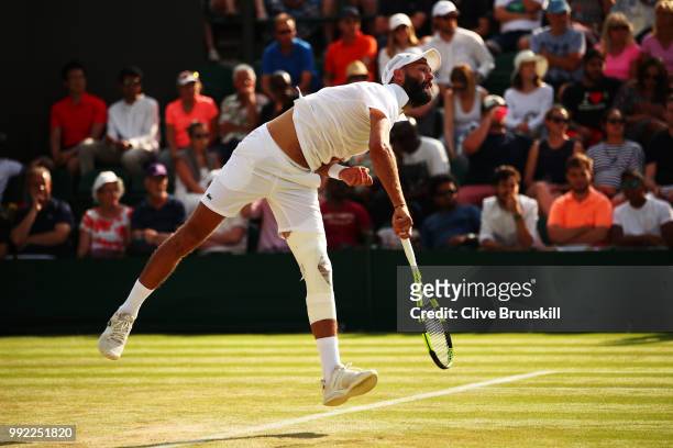 Benoit Paire of France serves against Denis Shapovalov of Canada during their Men's Singles second round match on day four of the Wimbledon Lawn...