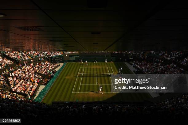 Feliciano Lopez of Spain serves against Juan Martin del Potro of Argentina during their Men's Singles second round match on day four of the Wimbledon...