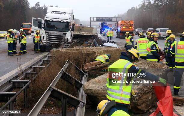 Emergency relief forces work on an accident site on motorway A3 near Nuremberg, Germany, 29 November 2017. A truck loaded with rocks had an accident...