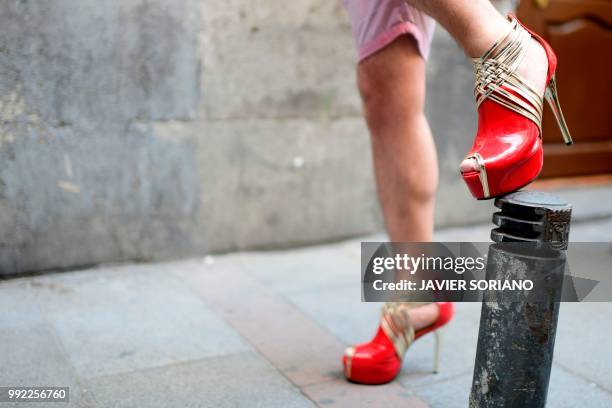 Participant shows his heels during the "High Heels Race" as part of the Gay Pride 2018 celebrations in Madrid on July 5, 2018.