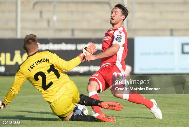 Paul Buechel of Union Fuerstenwalde and Peter Kurzweg of 1 FC Union Berlin fight for the ball during the test match between dem FSV Union...