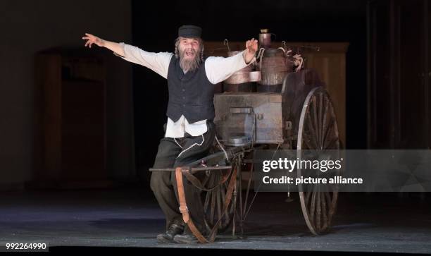 Actor Max Hopp as Milkman Tevje performs on stage during a photo rehearsal of the musical 'Anatevka' at the Komische Opera in Berlin, Germany, 29...