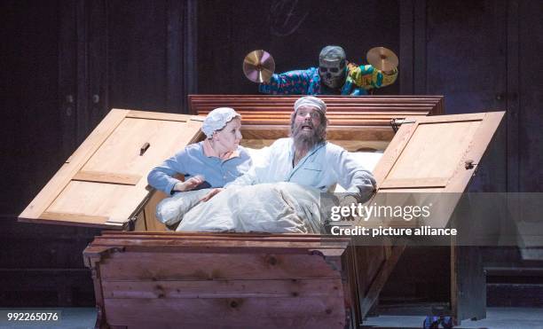 Actors Dagmar Manzel as Wife Golde and Max Hopp as Milkman Tevje performs on stage during a photo rehearsal of the musical 'Anatevka' at the Komische...