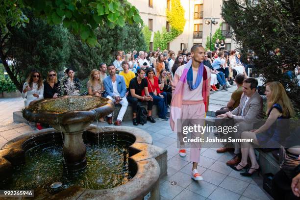 Model walks the runway at the Marcel Ostertag show during the Berlin Fashion Week Spring/Summer 2019 at Westin Grand Hotel on July 4, 2018 in Berlin,...