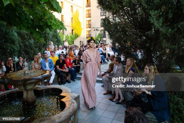 Model walks the runway at the Marcel Ostertag show during the Berlin Fashion Week Spring/Summer 2019 at Westin Grand Hotel on July 4, 2018 in Berlin,...