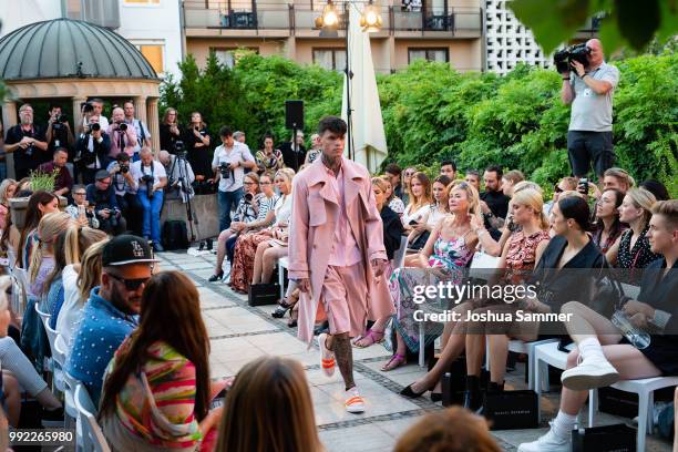 Model walks the runway at the Marcel Ostertag show during the Berlin Fashion Week Spring/Summer 2019 at Westin Grand Hotel on July 4, 2018 in Berlin,...