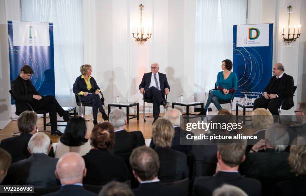 German President Frank-Walter Steinmeier and writers Daniel Kehlmann , Eva Menasse and Salman Rushdie sitting together with moderator Luzia Braun...