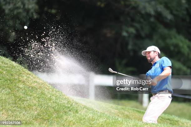 Robert Streb hits out of the bunker on the sixth hole during round one of A Military Tribute At The Greenbrier held at the Old White TPC course on...